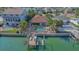 Back of waterfront house featuring a private pool, and a boat dock at 487 Harbor S Dr, Indian Rocks Beach, FL 33785