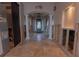Home's foyer featuring tiled floors, columns and a decorative chandelier at 487 Harbor S Dr, Indian Rocks Beach, FL 33785