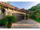 Close up of home's garage featuring custom trim and landscaping at 487 Harbor S Dr, Indian Rocks Beach, FL 33785