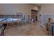 Open living room showcasing a tile flooring, with a glimpse of an adjoining bathroom at 487 Harbor S Dr, Indian Rocks Beach, FL 33785