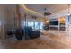 Spacious living room area with decor, tile flooring, ceiling fan, and lots of natural light at 487 Harbor S Dr, Indian Rocks Beach, FL 33785