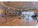 Bright living room with tile flooring, ceiling fan and lots of natural light from large windows at 487 Harbor S Dr, Indian Rocks Beach, FL 33785