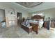 Comfortable main bedroom features a large bed, ensuite bathroom, furnishings and lots of natural light at 487 Harbor S Dr, Indian Rocks Beach, FL 33785