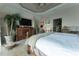 Comfortable main bedroom features large windows, ceiling fan, ensuite bathroom and dresser with mounted TV at 487 Harbor S Dr, Indian Rocks Beach, FL 33785