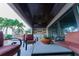 Covered patio with comfortable seating and an outdoor kitchen with beautiful waterfront views at 487 Harbor S Dr, Indian Rocks Beach, FL 33785