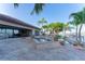 Beautiful pool and spa area with lush tropical landscaping and waterfront views at 487 Harbor S Dr, Indian Rocks Beach, FL 33785