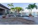 Backyard pool with waterfront views, beautiful brick trim, and landscaped surroundings at 487 Harbor S Dr, Indian Rocks Beach, FL 33785