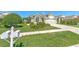 Attractive single-Gathering home with well-maintained front yard, landscaping, and attached two-car garage at 5046 Gato Del Sol Cir, Wesley Chapel, FL 33544