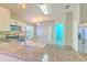 Bright kitchen featuring granite countertops, stainless steel appliances, and a large sink area at 5046 Gato Del Sol Cir, Wesley Chapel, FL 33544