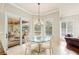 Cozy dining area with a glass table and views of the pool and lanai at 511 Duque Rd, Lutz, FL 33549
