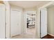 Bright hallway leading to an open kitchen with bar seating and lots of storage options at 511 Duque Rd, Lutz, FL 33549