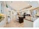 Bright, spacious kitchen with a large island, granite countertops, and modern appliances at 511 Duque Rd, Lutz, FL 33549