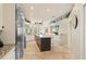 Expansive kitchen featuring a center island, stainless fridge, and great natural light at 511 Duque Rd, Lutz, FL 33549