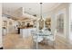 Open kitchen and dining area perfect for entertaining with a view to the pool at 511 Duque Rd, Lutz, FL 33549