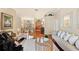 Elegant living room featuring hardwood floors, comfortable seating, and access to other rooms in the house at 511 Duque Rd, Lutz, FL 33549