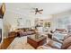 Spacious living room featuring a ceiling fan, a view to the kitchen and a cozy seating area at 511 Duque Rd, Lutz, FL 33549