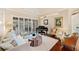 Elegant living room features a grand piano, plush seating, and lots of natural light at 511 Duque Rd, Lutz, FL 33549