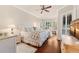 Elegant main bedroom with wood floors, large windows with plantation shutters and ceiling fan at 511 Duque Rd, Lutz, FL 33549