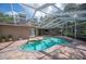 Inviting backyard pool area with covered patio, perfect for outdoor entertaining and relaxation at 511 Duque Rd, Lutz, FL 33549