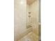 This beautifully tiled shower includes a built-in bench and convenient corner shelves at 511 Duque Rd, Lutz, FL 33549