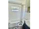 Bright bathroom with white subway tile, an updated vanity, and mosaic tile flooring at 5130 Pine Grove S Ter, Gulfport, FL 33707