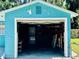 Spacious garage with laundry, storage, and plenty of room for a vehicle at 5130 Pine Grove S Ter, Gulfport, FL 33707