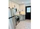 Updated kitchen features stainless steel appliances, granite countertops, and modern cabinets at 5130 Pine Grove S Ter, Gulfport, FL 33707