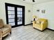 Bright living room with tile floors and comfortable seating, flooded with natural light at 5130 Pine Grove S Ter, Gulfport, FL 33707
