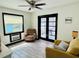 Bright living room with tile floors, comfortable seating, and large windows at 5130 Pine Grove S Ter, Gulfport, FL 33707