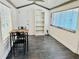 Bright sun room with tile floors, large windows, and casual dining set at 5130 Pine Grove S Ter, Gulfport, FL 33707