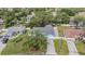 A high angle showing the blue house with mature trees and an extended driveway at 5283 Bevens Ave, Spring Hill, FL 34608