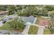 A high angle showing the blue house with mature trees and an extended driveway at 5283 Bevens Ave, Spring Hill, FL 34608