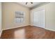 Bedroom with hardwood floors, closet space, a ceiling fan, and natural light at 5283 Bevens Ave, Spring Hill, FL 34608
