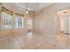 Tile-floored breakfast nook with decorative curtains and ample sunlight at 5283 Bevens Ave, Spring Hill, FL 34608