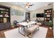Dining room with vaulted ceiling, elegant furnishings, and natural light for a welcoming ambiance at 5283 Bevens Ave, Spring Hill, FL 34608