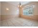 Well-lit dining room featuring tile flooring and decorative lighting fixtures at 5283 Bevens Ave, Spring Hill, FL 34608