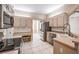 Eat-in kitchen featuring built-in desk, stainless appliances, and tile floors at 5283 Bevens Ave, Spring Hill, FL 34608