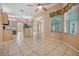 Spacious open kitchen with tile flooring, island, and ample natural lighting at 5283 Bevens Ave, Spring Hill, FL 34608