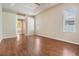 Spacious main bedroom featuring tray ceiling, wood floors, and an ensuite bathroom at 5283 Bevens Ave, Spring Hill, FL 34608