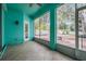 Relaxing screened-in patio with tile flooring and views of the private backyard at 5283 Bevens Ave, Spring Hill, FL 34608
