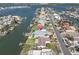 Aerial view of waterfront property with boat dock, offering direct access to the waterways and a desirable coastal living experience at 538 Crystal Dr, Madeira Beach, FL 33708