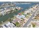 Aerial view of waterfront home with dock and neighborhood canals, perfect for boating and enjoying the water at 538 Crystal Dr, Madeira Beach, FL 33708