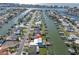 Aerial view of property with pool and canal, in a community with waterfront access, promising serene living at 538 Crystal Dr, Madeira Beach, FL 33708