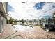 Backyard featuring a swimming pool, brick patio area, and views of the channel at 538 Crystal Dr, Madeira Beach, FL 33708