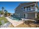 Backyard featuring a swimming pool, brick patio area, and tropical landscaping at 538 Crystal Dr, Madeira Beach, FL 33708