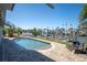 Backyard featuring a swimming pool, brick patio area, and channel views at 538 Crystal Dr, Madeira Beach, FL 33708