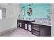 Bright bathroom featuring a double vanity, granite countertops, and stylish oval mirrors at 538 Crystal Dr, Madeira Beach, FL 33708