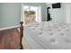 King size bed inside a bedroom with doors that lead to a porch at 538 Crystal Dr, Madeira Beach, FL 33708