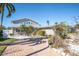 Charming home featuring lush landscaping, a brick driveway, and a well-maintained exterior in a desirable neighborhood at 538 Crystal Dr, Madeira Beach, FL 33708