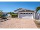 Charming two-story home with brick driveway, garage, and well-maintained landscaping at 538 Crystal Dr, Madeira Beach, FL 33708